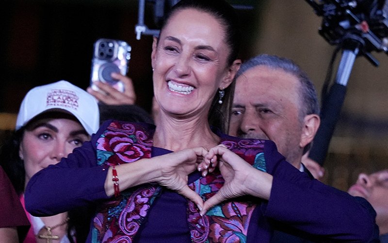 Claudia Sheinbaum, the presidential candidate of Mexico's ruling Morena party, gestures to her supporters at Zócalo plaza in Mexico City June 3, 2024.